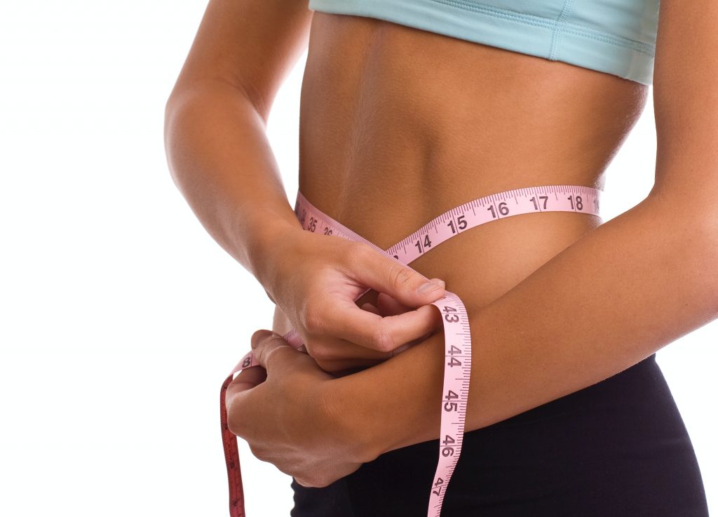 Weight: Tape measure around girl's waist. She want to control her weightt