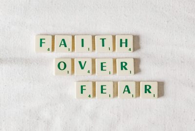 Scrabble letters spelling out Faith over Fear